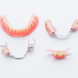 Partial and full dentures on white background\