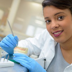 Lab technician building dentures