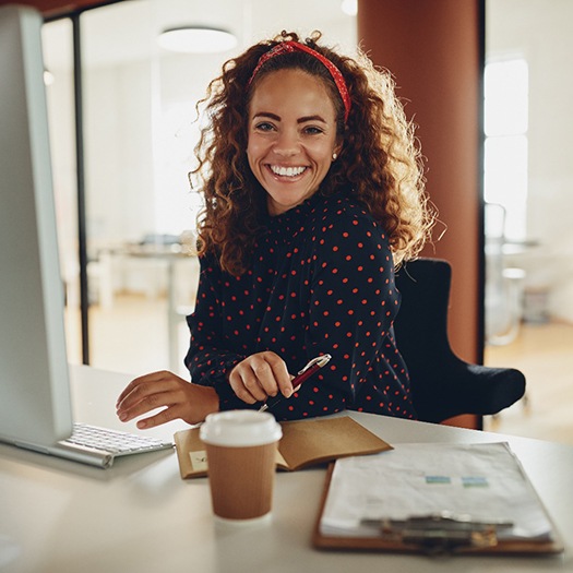 Businesswoman with very white teeth smiling