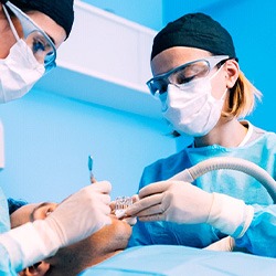 Dentists performing surgery