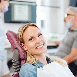 Woman smiling in the dental chair