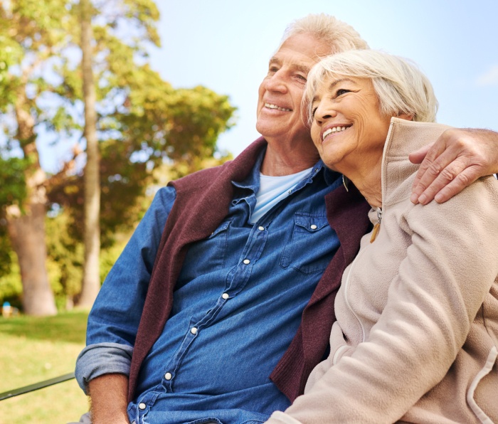 Older couple smiling outdoors