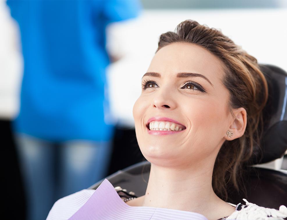 Relaxed patient smiling during sedation dentistry visit