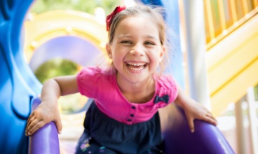 Little girl laughing after children's dentistry visit