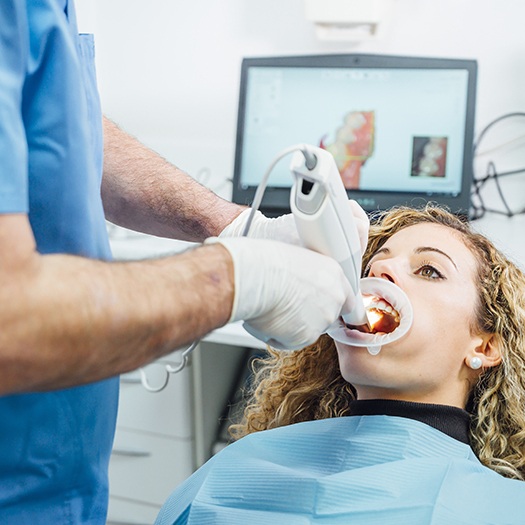 Dentist capturing images with intraoral camera