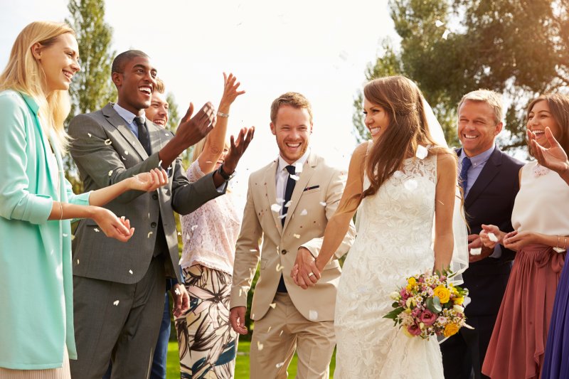 people smiling at a wedding